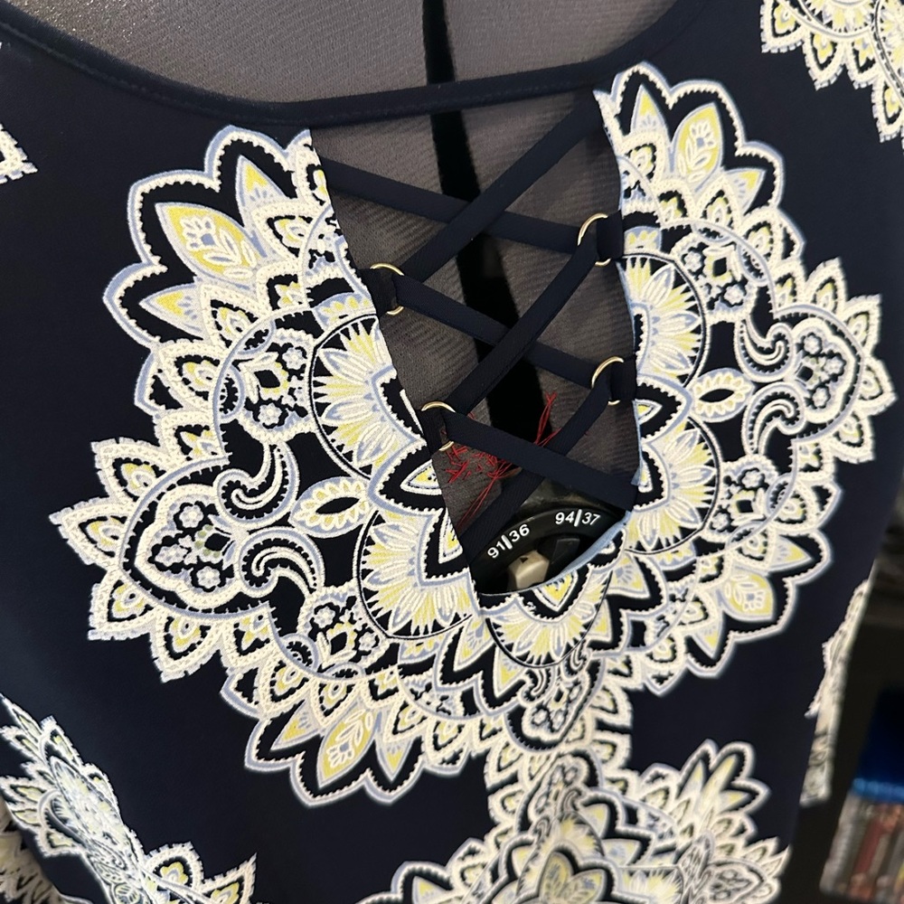 Women’s blue dress with white and pale yellow flowers